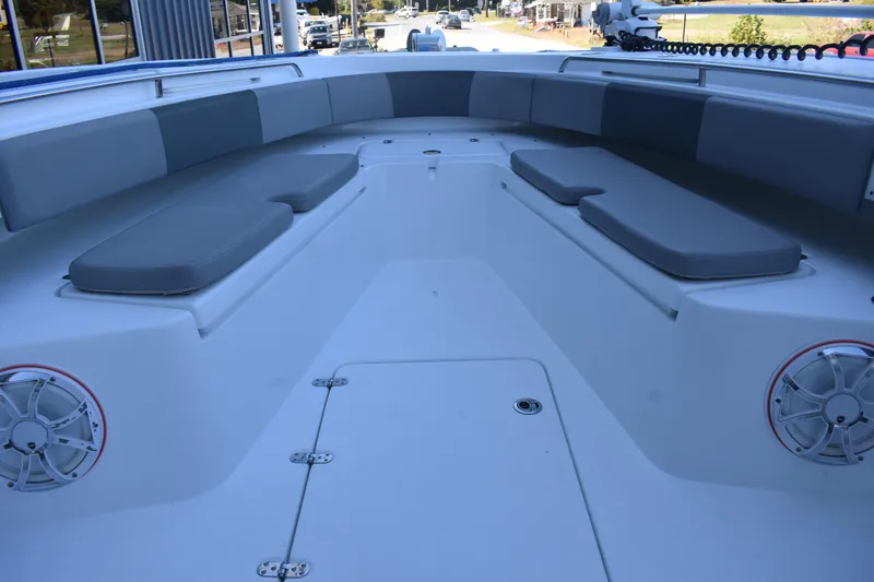 Slide: The Image of 2021 Cape Horn 36 XS boat interior with cushioned seating and speakers. - 9