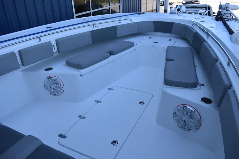Slide: The Image of 2021 Cape Horn 36 XS boat interior with cushioned seating and speakers. - 11