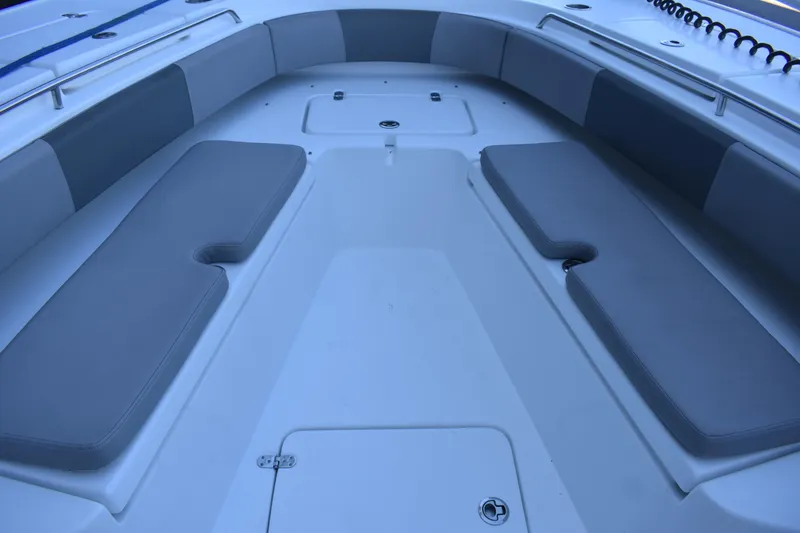 Slide: The Image of 2021 Cape Horn 36 XS boat interior with cushioned seating and storage compartments. - 12