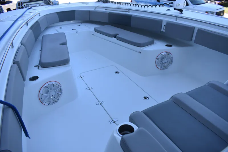Slide: The Image of 2021 Cape Horn 36 XS boat interior with cushioned seating and speakers. - 13
