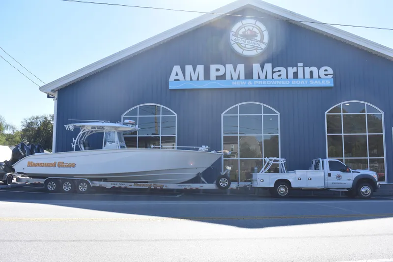 Slide: The Image of 2021 Cape Horn 36 XS boat on trailer outside AM PM Marine dealership. - 2