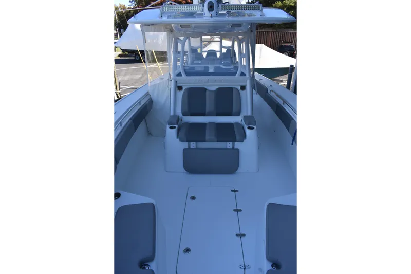 Slide: The Image of 2021 Cape Horn 36 XS boat interior with seating and console, showcasing modern design. - 21