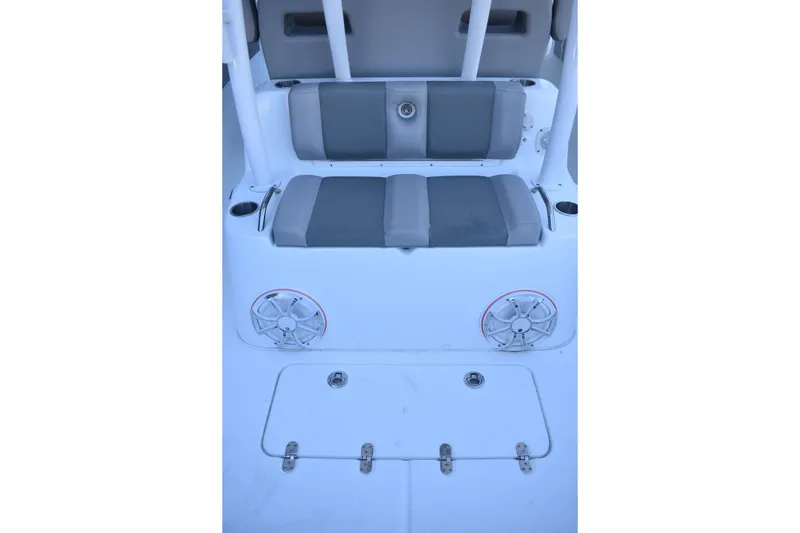 Slide: The Image of 2021 Cape Horn 36 XS boat seating area with speakers and storage compartment. - 27
