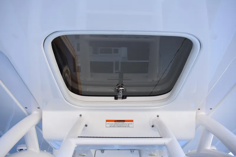 Slide: The Image of 2021 Cape Horn 36 XS boat hatch with secure latch and warning label. - 35