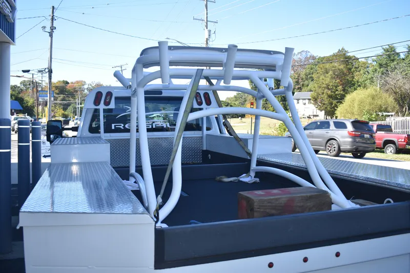 Slide: The Image of 2021 Cape Horn 36 XS boat frame loaded on a truck bed in a parking lot. - 8