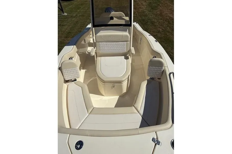 Slide: The Image of 2026 Scout 215 XSF boat interior with cushioned seating and storage compartments. - 5