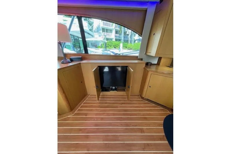 Slide: The Image of Interior of 2003 Post Flybridge Convertible yacht with wooden flooring and cabinetry. - 15