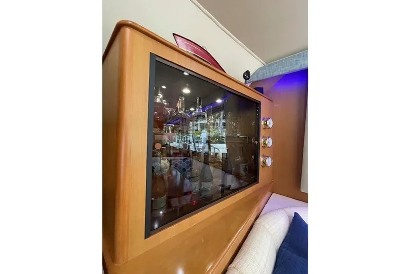 Slide: The Image of Bar cabinet with assorted liquor bottles on a 2003 Post Flybridge Convertible yacht. - 20