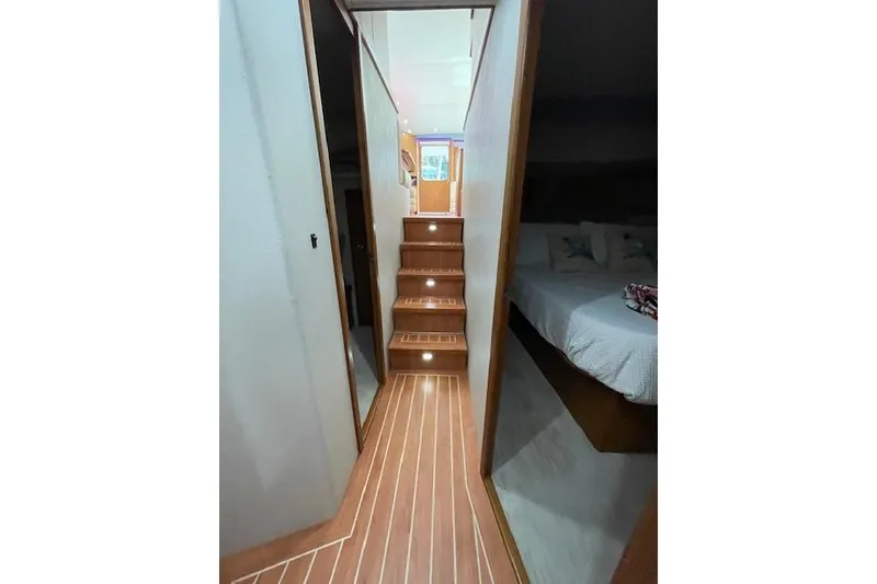 Slide: The Image of Interior hallway of 2003 Post Flybridge Convertible with wooden cabinet and modern design. - 35