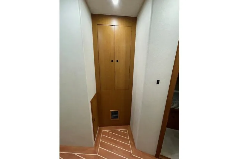 Slide: The Image of 2003 Post Flybridge Convertible interior with built-in laundry appliances. - 36