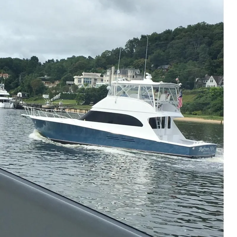 Slide: The Image of 2003 Post Flybridge Convertible yacht with spacious deck and seating area. - 4