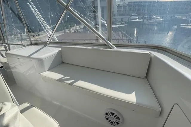 Slide: The Image of 2003 Post Flybridge Convertible yacht helm with modern navigation equipment and steering wheel. - 49