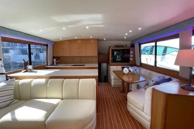 Slide: The Image of Luxurious interior of a 2003 Post Flybridge Convertible yacht with elegant seating and wood finishes. - 5