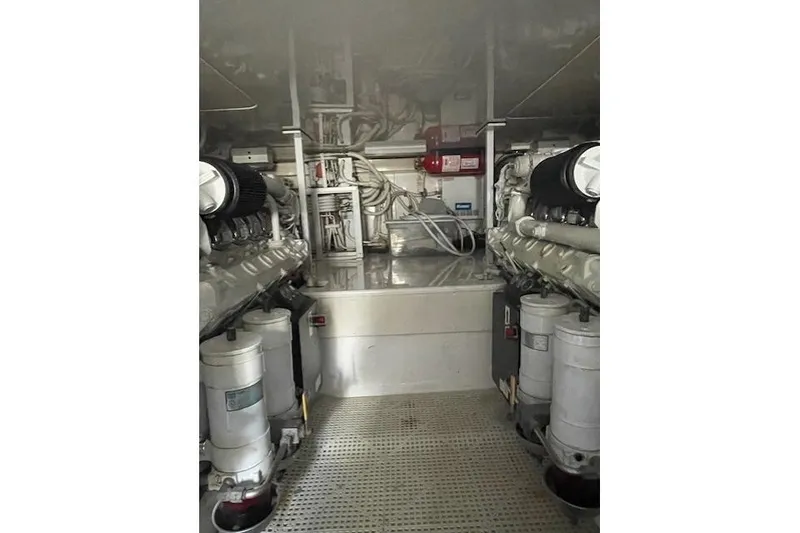 Slide: The Image of Engine room of 2003 Post Flybridge Convertible yacht, showcasing mechanical components. - 52