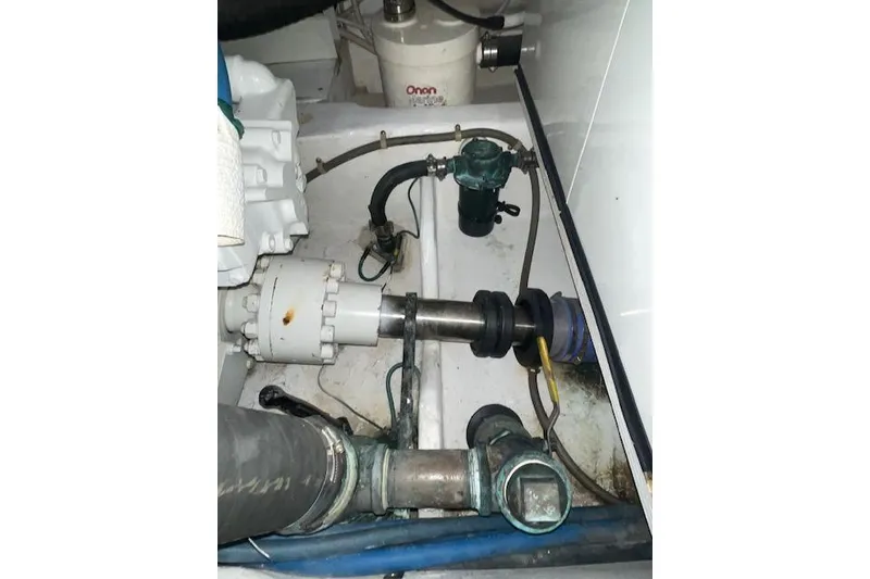 Slide: The Image of Engine room of 2003 Post Flybridge Convertible with complex piping and machinery. - 55