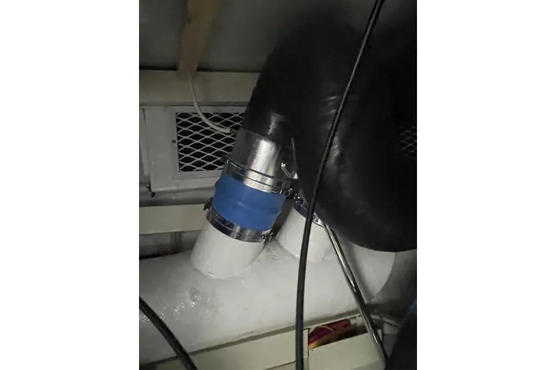 Slide: The Image of Engine room of 2003 Post Flybridge Convertible boat, showcasing mechanical components. - 59