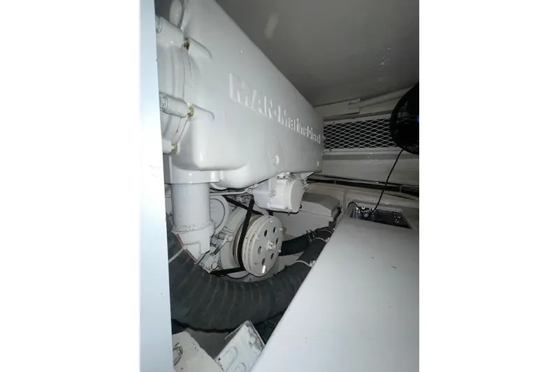 Slide: The Image of Engine room of 2003 Post Flybridge Convertible boat, showcasing detailed machinery components. - 60