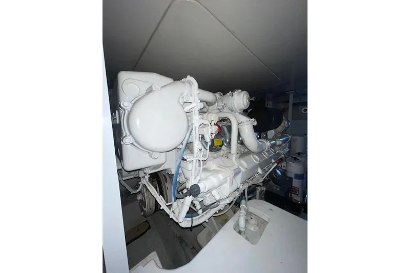 Slide: The Image of Engine room of 2003 Post Flybridge Convertible yacht, showcasing machinery and equipment. - 63