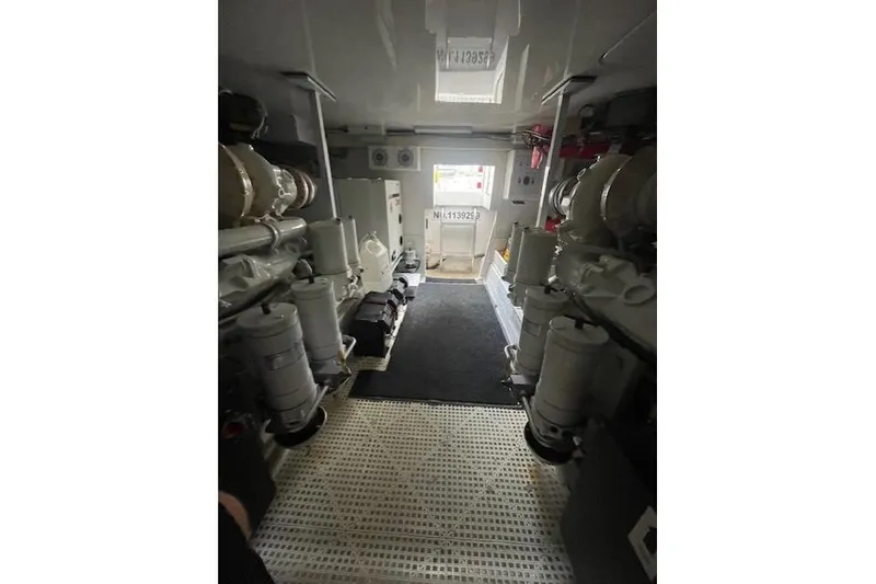 Slide: The Image of Engine room of 2003 Post Flybridge Convertible with Onan generator and CO warning label. - 64