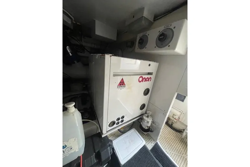 Slide: The Image of Engine room of 2003 Post Flybridge Convertible boat, showcasing mechanical components and wiring. - 65