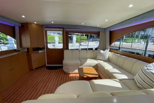 Slide: The Image of Luxurious interior of 2003 Post Flybridge Convertible yacht with plush seating and elegant wood finishes. - 9