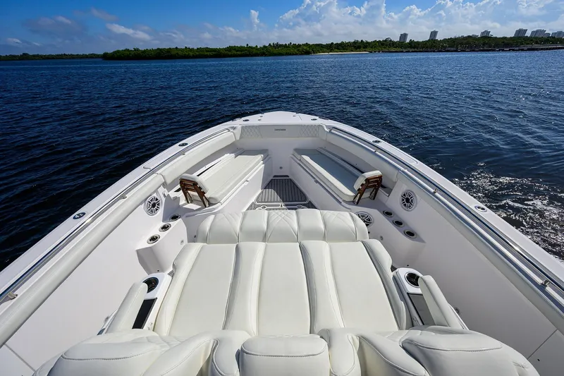 Slide: The Image of Luxurious 2024 Everglades 455 Center Console boat with plush seating on open water. - 17