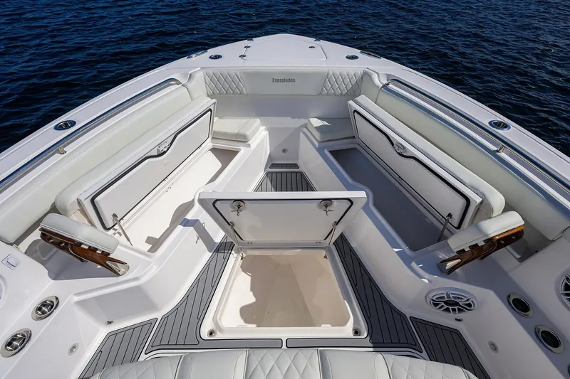 Slide: The Image of 2024 Everglades 455 Center Console boat interior with seating and storage compartments. - 18