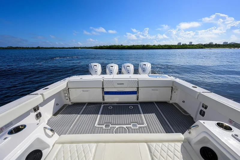 Slide: The Image of 2024 Everglades 455 Center Console boat with quad engines on open water. - 28