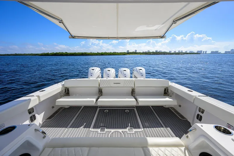 Slide: The Image of 2024 Everglades 455 Center Console boat with spacious deck and ocean view. - 34