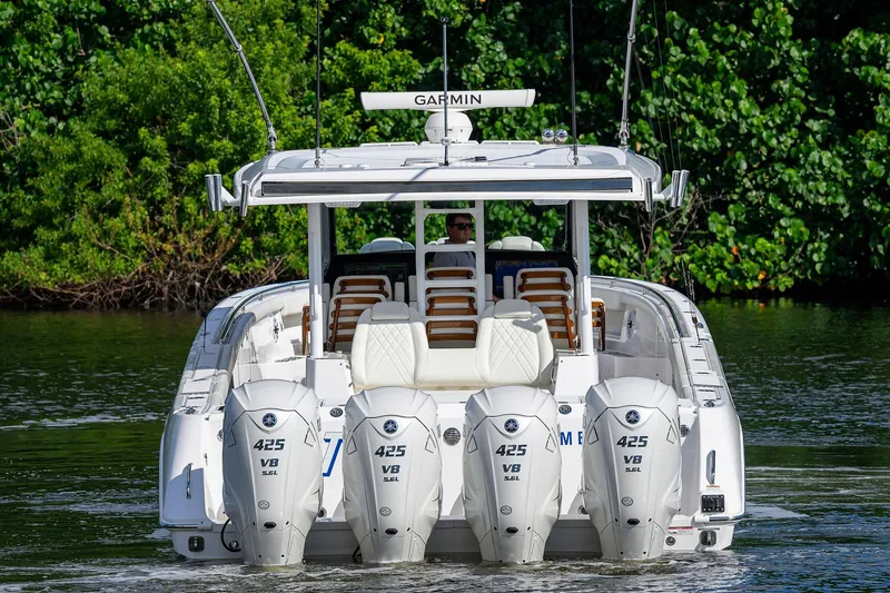 Slide: The Image of 2024 Everglades 455 Center Console boat with four powerful engines on water. - 5