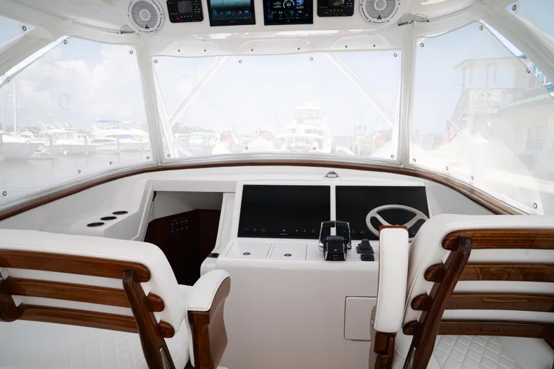 Slide: The Image of Interior view of 2026 Front Runner 47' Walk Around yacht cockpit with modern controls. - 3