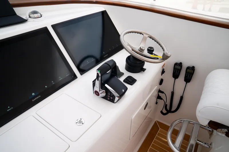 Slide: The Image of Helm of 2026 Front Runner 47' Walk Around with Garmin displays and controls. - 4