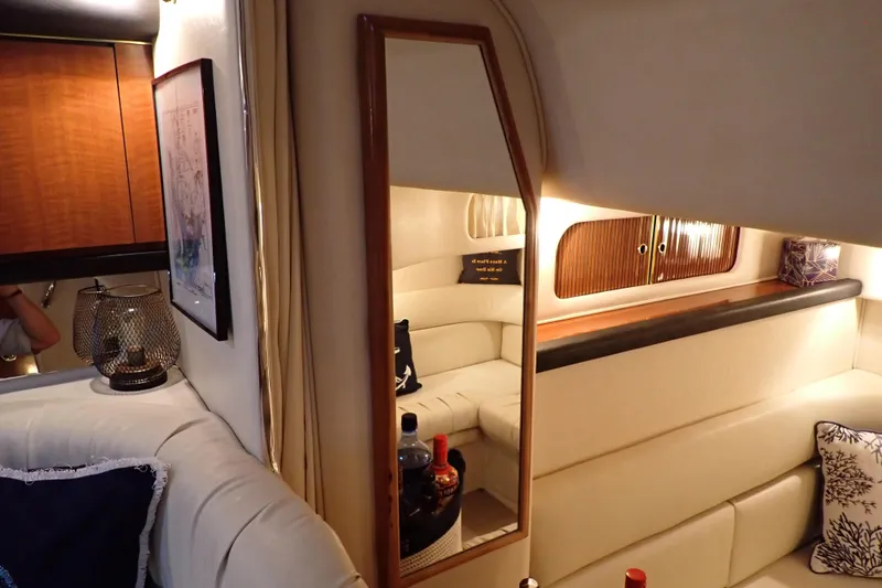 Slide: The Image of Interior of 2002 Sea Ray 340 Sundancer yacht with cozy seating and elegant decor. - 108