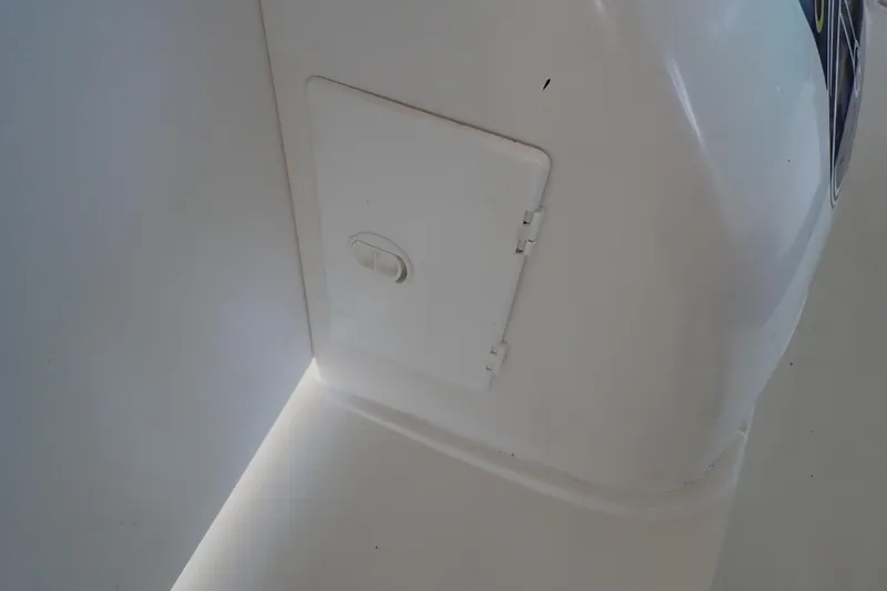 Slide: The Image of White compartment door on a 2002 Sea Ray 340 Sundancer boat interior. - 118