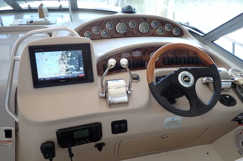 Slide: The Image of Control panel of a 2002 Sea Ray 340 Sundancer boat with navigation system. - 12