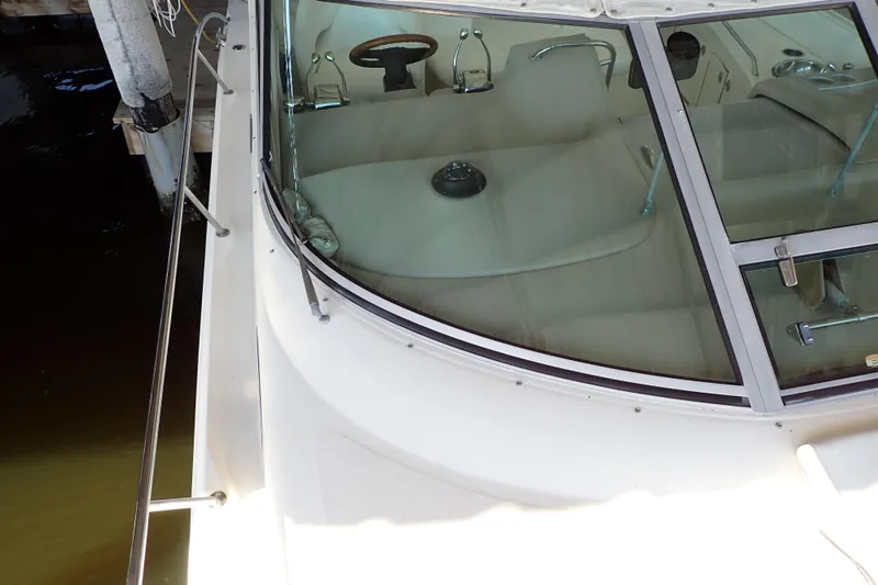 Slide: The Image of 2002 Sea Ray 340 Sundancer boat, view of cockpit and windshield. - 124