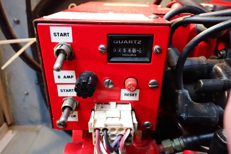 Slide: The Image of Control panel of a 2002 Sea Ray 340 Sundancer boat engine with hour meter and switches. - 135