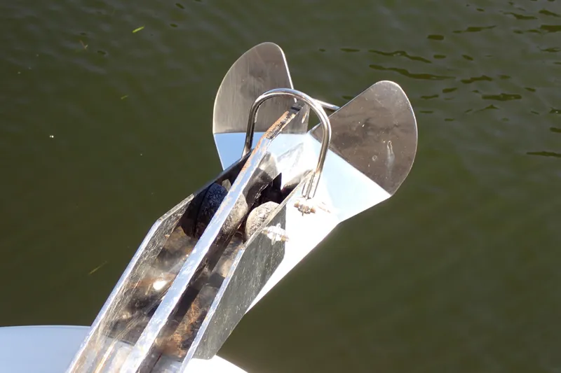 Slide: The Image of Anchor of 2002 Sea Ray 340 Sundancer boat on calm water. - 22