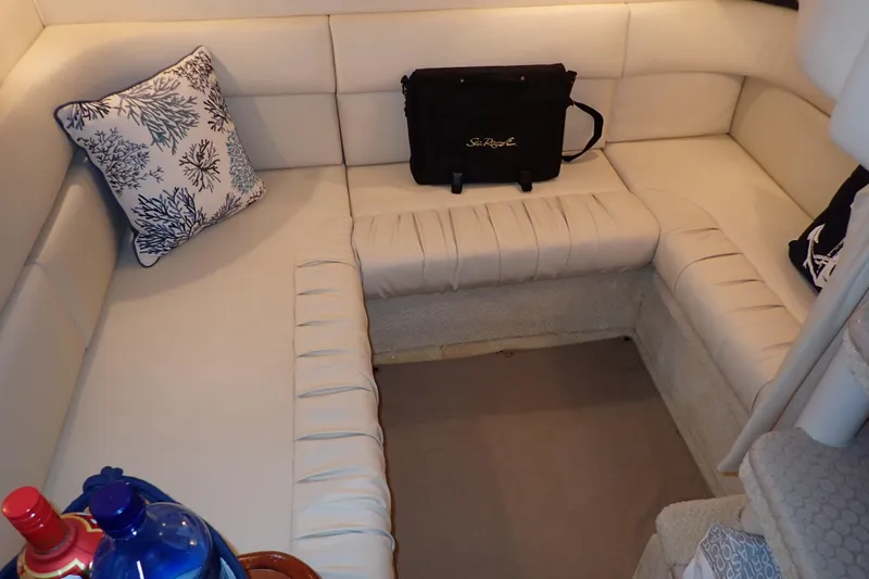 Slide: The Image of Cozy interior seating of 2002 Sea Ray 340 Sundancer with decorative pillows. - 29