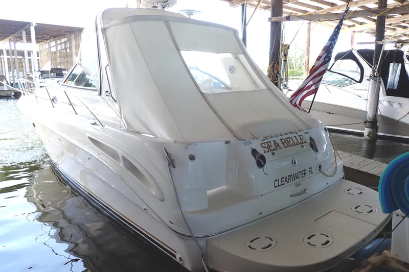 Slide: The Image of 2002 Sea Ray 340 Sundancer docked in marina, Clearwater, FL, with American flag. - 3