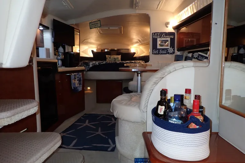 Slide: The Image of Interior of 2002 Sea Ray 340 Sundancer yacht with cozy seating and bar area. - 30
