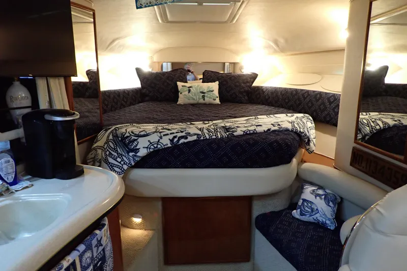 Slide: The Image of Interior of 2002 Sea Ray 340 Sundancer with cozy bed and elegant decor. - 33