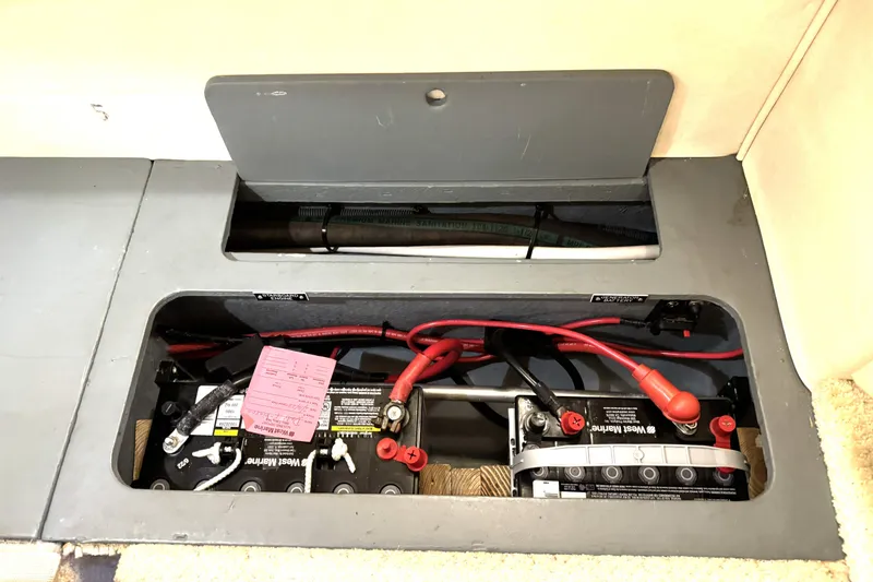 Slide: The Image of Battery compartment of a 2002 Sea Ray 340 Sundancer with visible wiring and components. - 37