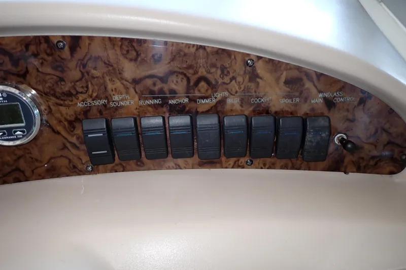 Slide: The Image of Control panel of 2002 Sea Ray 340 Sundancer boat with various switches. - 41