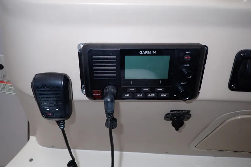 Slide: The Image of Garmin marine radio on 2002 Sea Ray 340 Sundancer dashboard. - 42