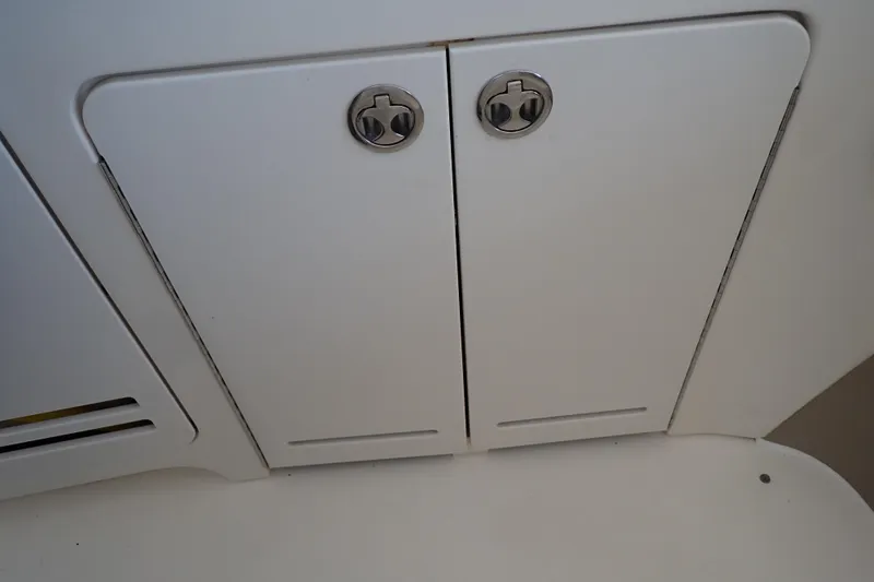 Slide: The Image of Cabinet doors on a 2002 Sea Ray 340 Sundancer boat interior. - 48