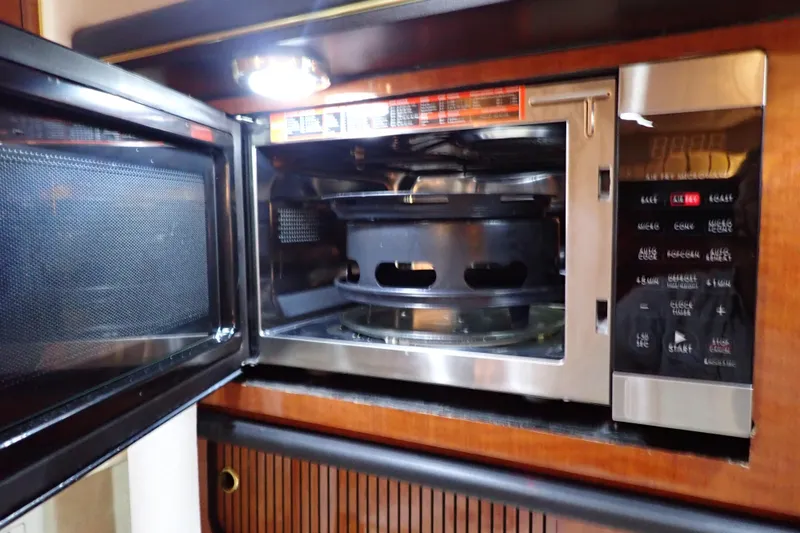 Slide: The Image of Open microwave inside a 2002 Sea Ray 340 Sundancer yacht kitchen. - 71