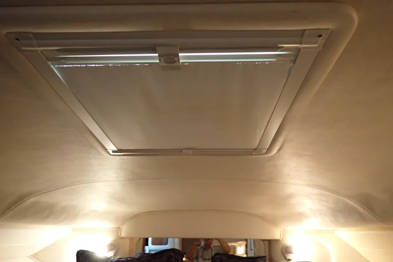 Slide: The Image of Interior cabin view of 2002 Sea Ray 340 Sundancer with ceiling hatch. - 83