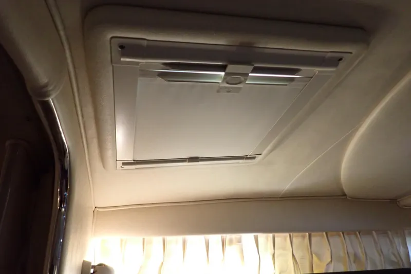 Slide: The Image of Ceiling hatch inside 2002 Sea Ray 340 Sundancer boat cabin, featuring a closed panel. - 85