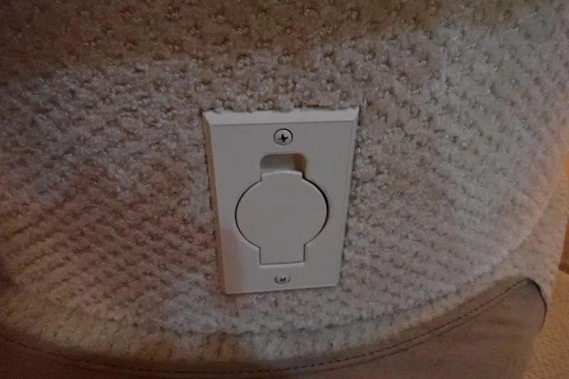 Slide: The Image of Electrical outlet on 2002 Sea Ray 340 Sundancer boat interior wall. - 99